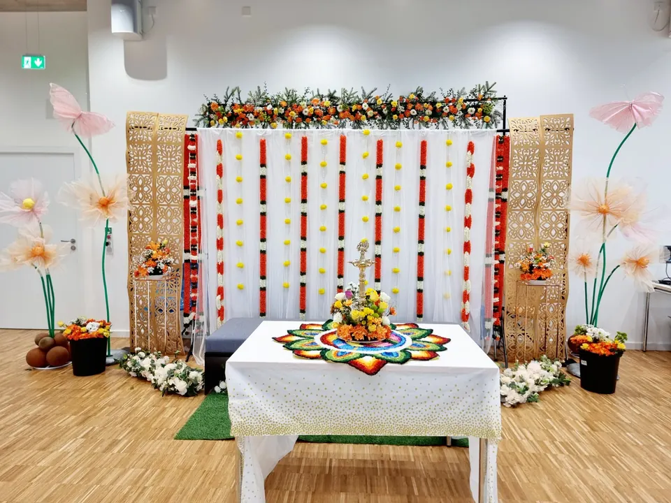 Indian traditional décor with colourful floral garlands, rangoli, brass lamps and a festive backdrop